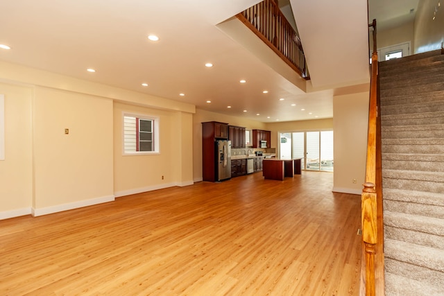 unfurnished living room featuring light hardwood / wood-style floors