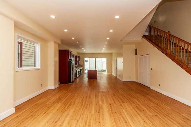 unfurnished living room featuring light hardwood / wood-style floors