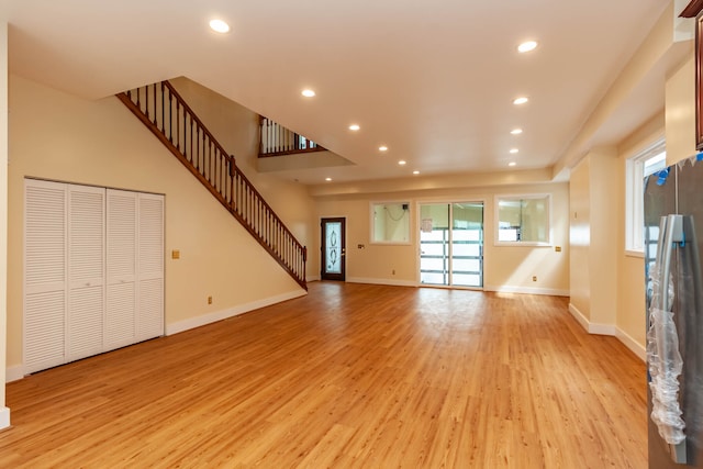 unfurnished living room with light hardwood / wood-style floors