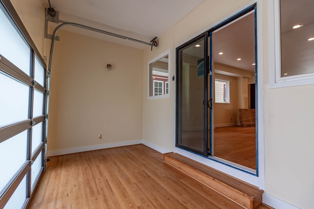 spare room with light hardwood / wood-style flooring