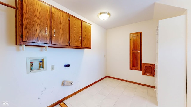 clothes washing area featuring cabinets and washer hookup