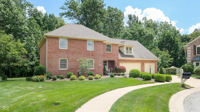 view of front facade featuring a garage and a front yard