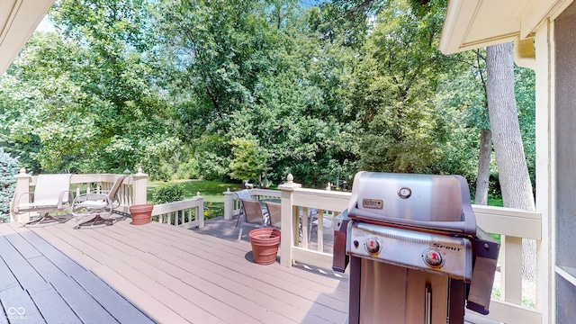 wooden terrace featuring area for grilling