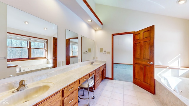 bathroom featuring vanity, tile patterned flooring, and tiled bath