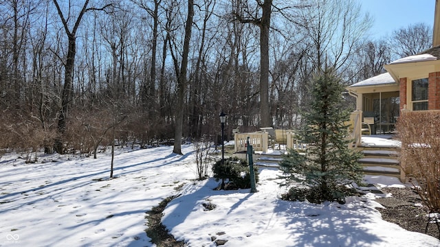 view of yard layered in snow