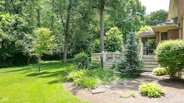 view of yard featuring a wooden deck