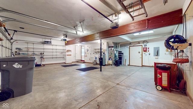 garage with a garage door opener and electric panel