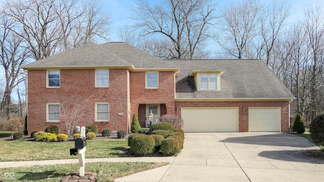 view of front of house featuring a garage and a front yard