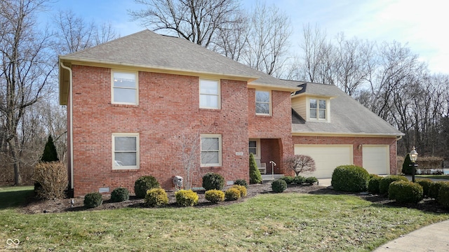 view of front facade with a garage and a front lawn