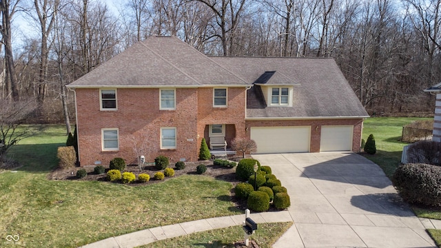 4738 Moss Creek Ct, Indianapolis, IN 46237 - view of front facade featuring an attached garage, brick siding, driveway, a front yard, and a shingled roof