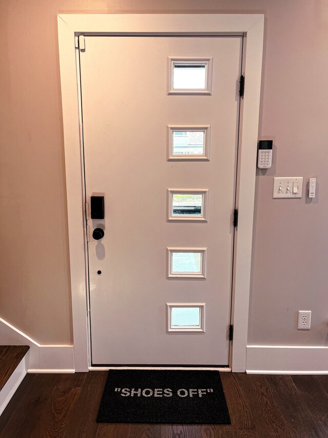 doorway to outside with dark hardwood / wood-style floors