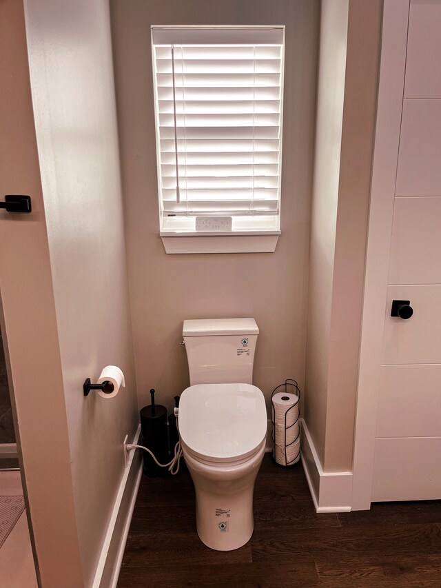 bathroom featuring toilet and hardwood / wood-style floors