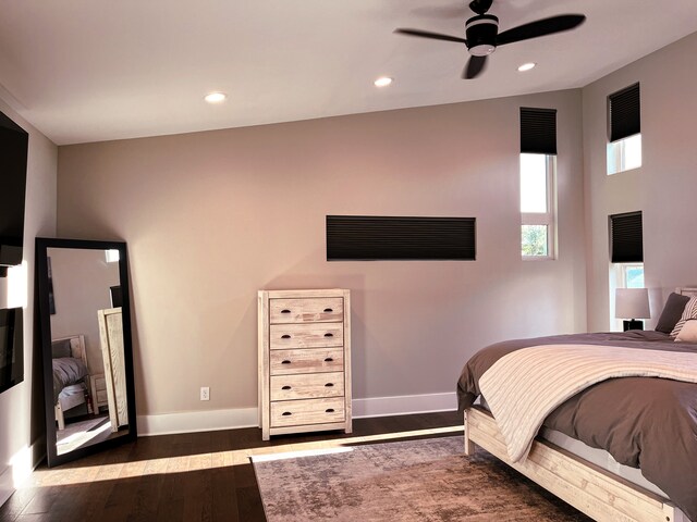 bedroom featuring ceiling fan and dark wood-type flooring