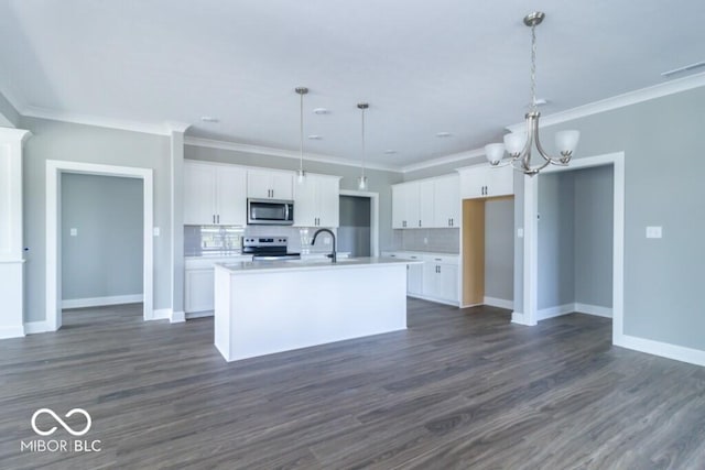 kitchen with hanging light fixtures, stainless steel appliances, white cabinets, and a center island with sink