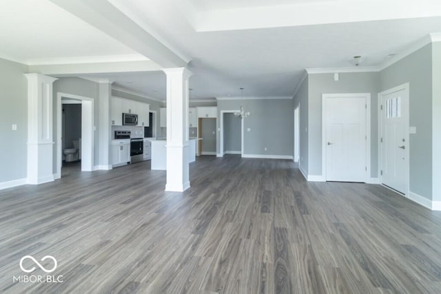 unfurnished living room with ornate columns, ornamental molding, a notable chandelier, and dark hardwood / wood-style flooring