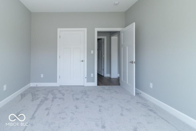 unfurnished bedroom featuring carpet