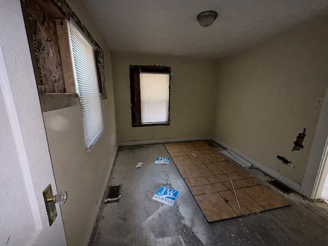 spare room featuring plenty of natural light