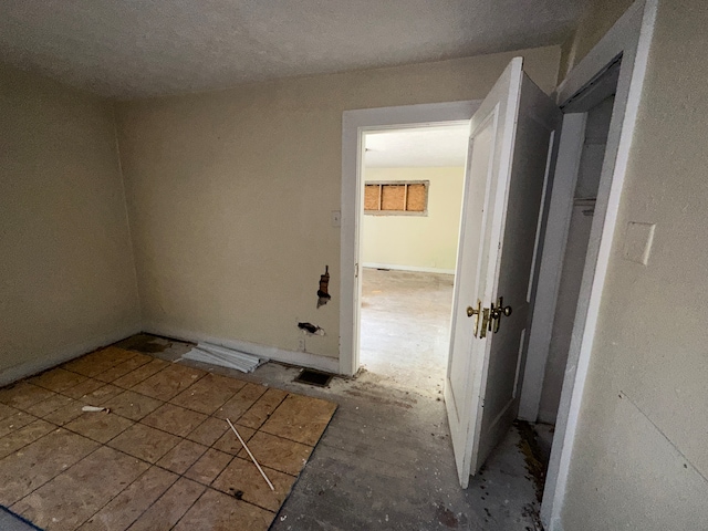 empty room with a textured ceiling