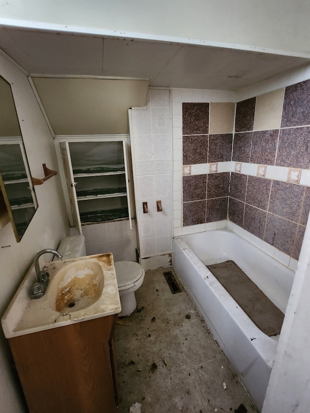 bathroom featuring tile walls, toilet, and vanity