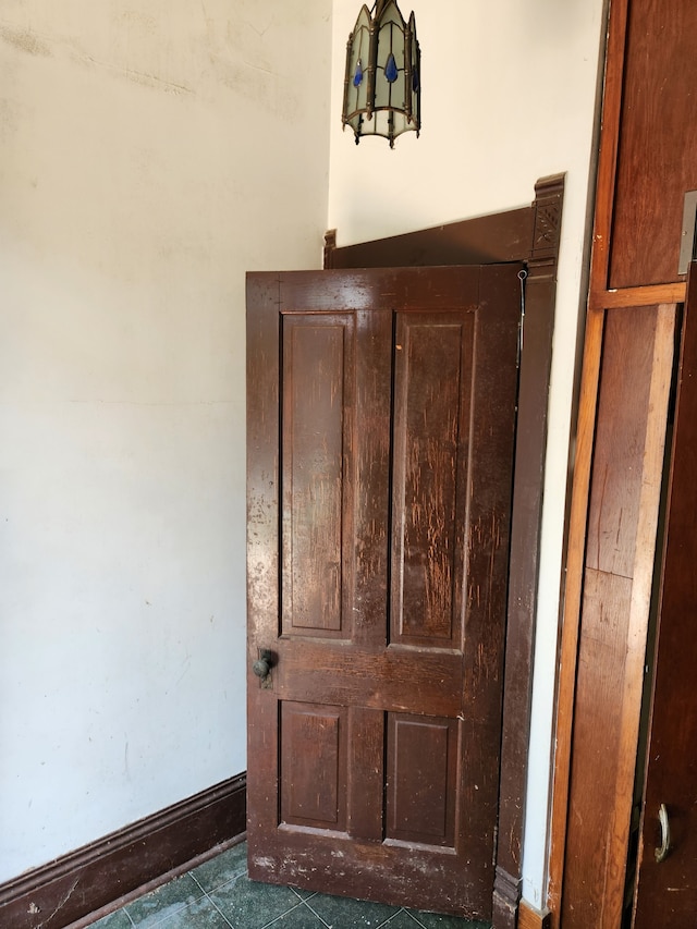 room details featuring dark tile floors