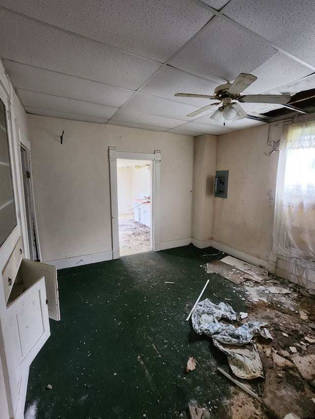 spare room featuring ceiling fan and a drop ceiling