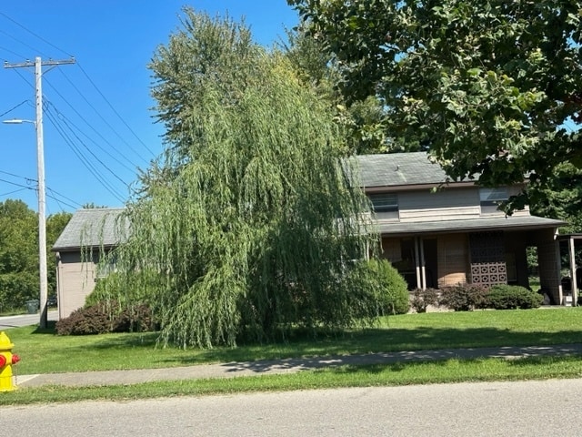 643 Pratt St, Greenfield, IN 46140 - view of property hidden behind natural elements with a front yard