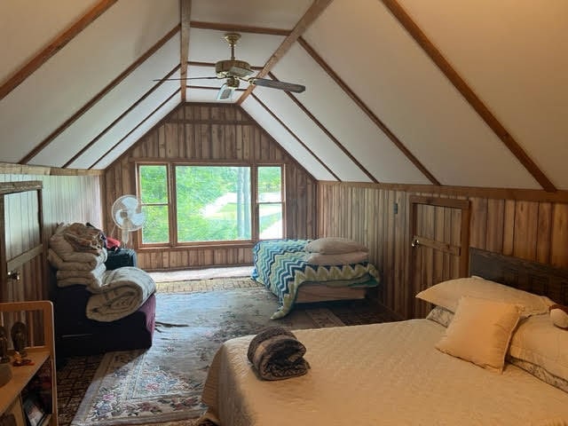 bedroom featuring lofted ceiling and ceiling fan