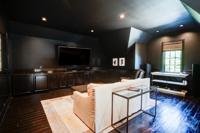 interior space with dark hardwood / wood-style flooring and vaulted ceiling