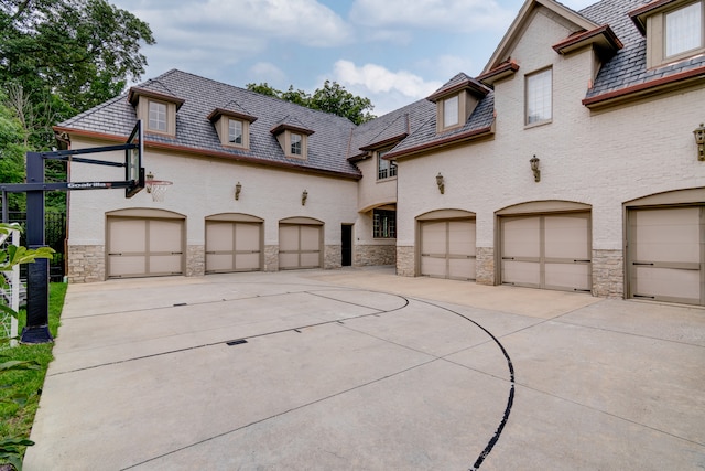 french country style house featuring a garage