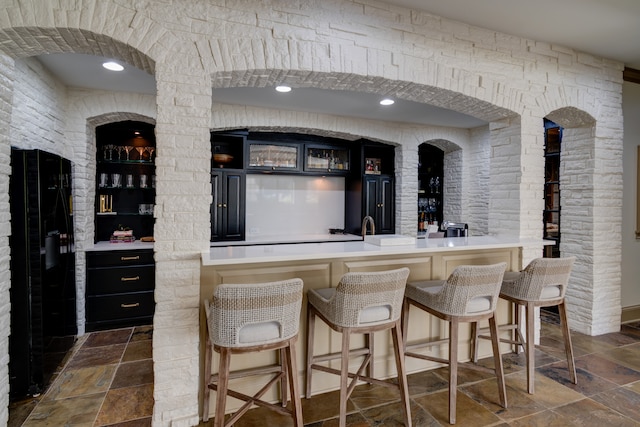 bar with dark tile flooring