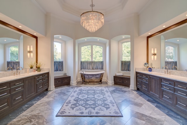 bathroom featuring double vanity, a tray ceiling, tile flooring, and a notable chandelier