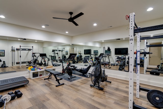 workout area with ceiling fan and light hardwood / wood-style flooring