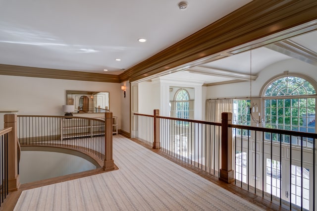 hall with a notable chandelier and light hardwood / wood-style floors