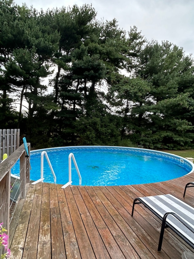 view of pool with a wooden deck