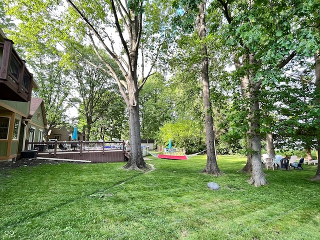 view of yard with a wooden deck