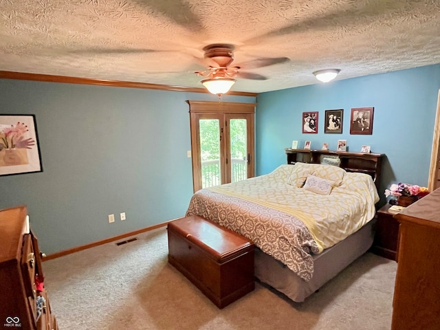 bedroom featuring light carpet, a textured ceiling, access to exterior, and ceiling fan