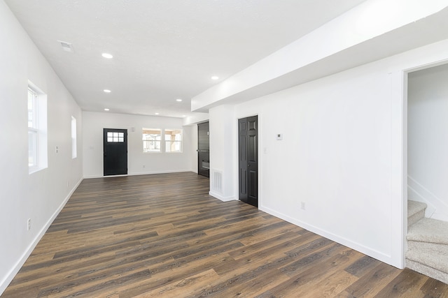 spare room featuring dark hardwood / wood-style flooring