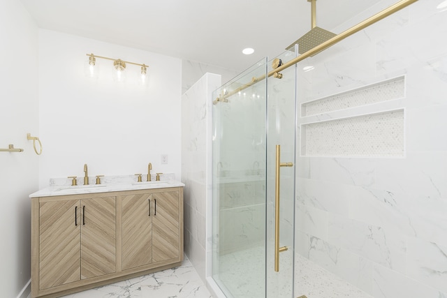 bathroom featuring a shower with shower door and dual bowl vanity