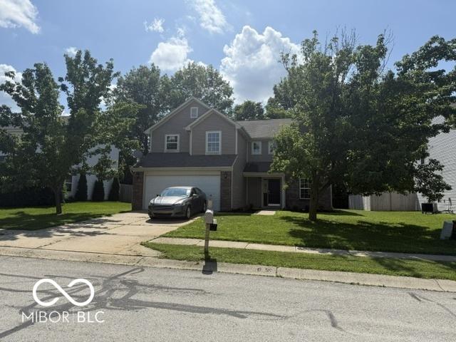 17902 Cristin Way, Westfield, IN 46062 - traditional home featuring driveway, a garage, and a front yard