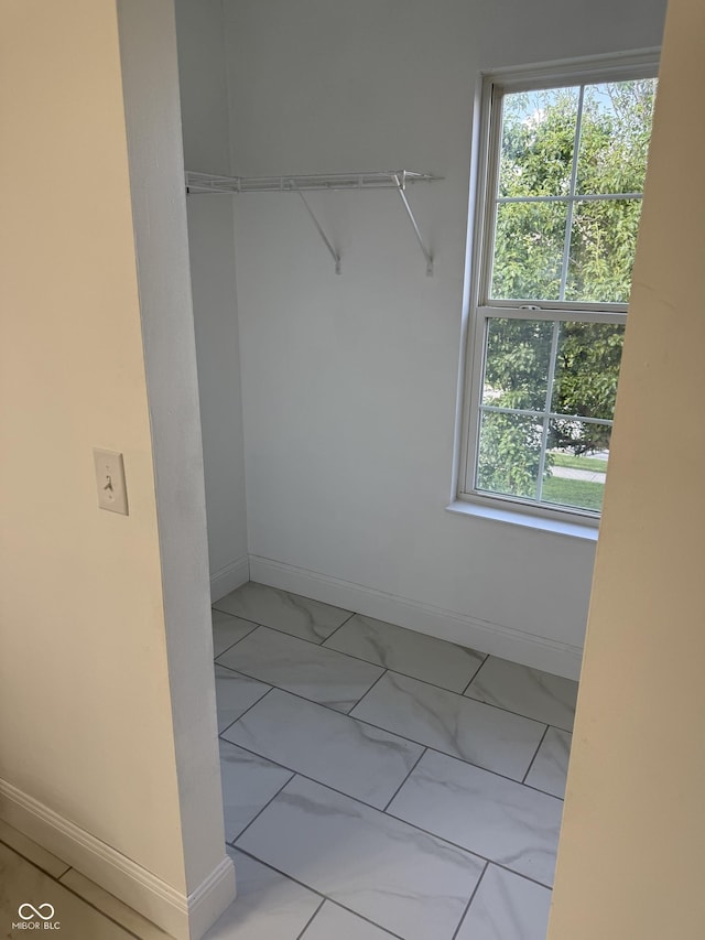 17902 Cristin Way, Westfield, IN 46062 - walk in closet featuring marble look tiles