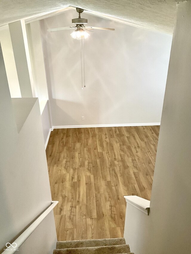 1327 Blue Ridge Ln, Brownsburg, IN 46112 - empty room featuring ceiling fan, wood finished floors, stairway, and baseboards
