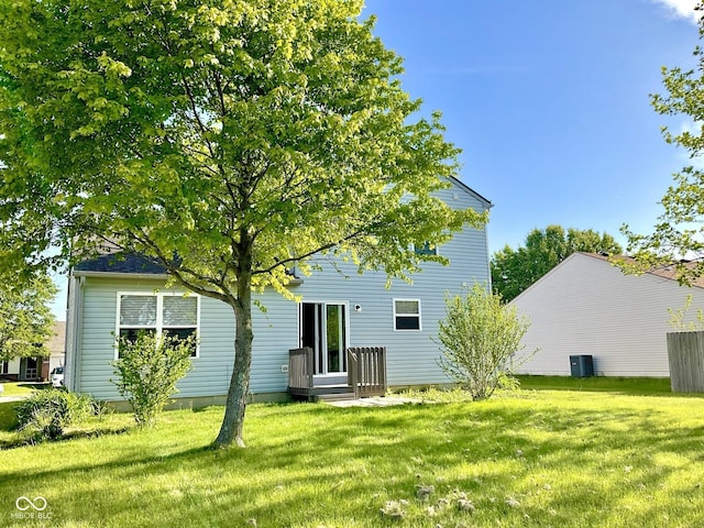 1327 Blue Ridge Ln, Brownsburg, IN 46112 - back of property with a lawn and central air condition unit