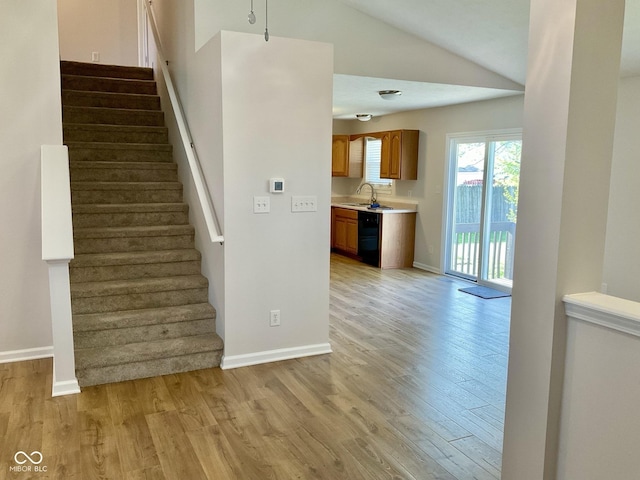 1327 Blue Ridge Ln, Brownsburg, IN 46112 - stairs featuring wood finished floors, lofted ceiling, and baseboards
