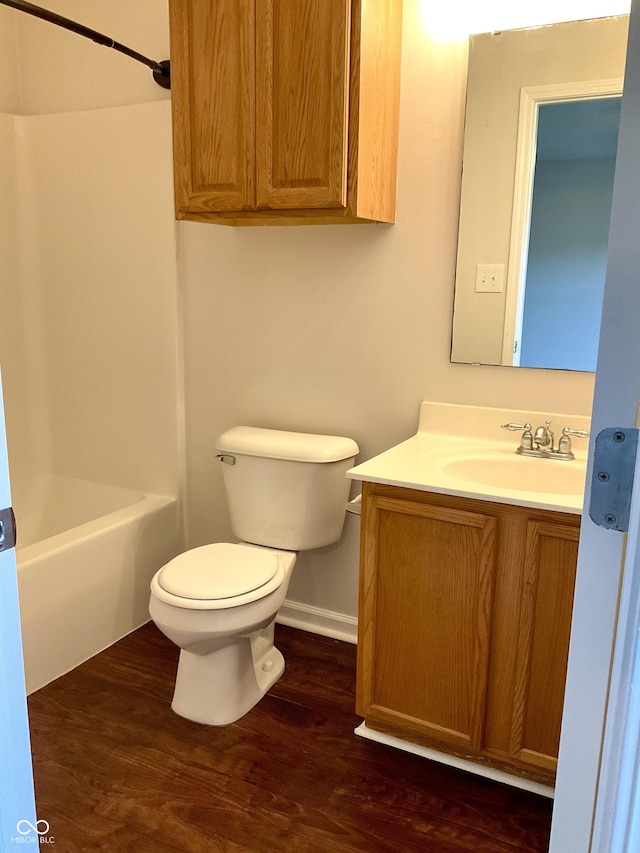 1327 Blue Ridge Ln, Brownsburg, IN 46112 - bathroom with toilet, wood finished floors, vanity, baseboards, and tub / shower combination