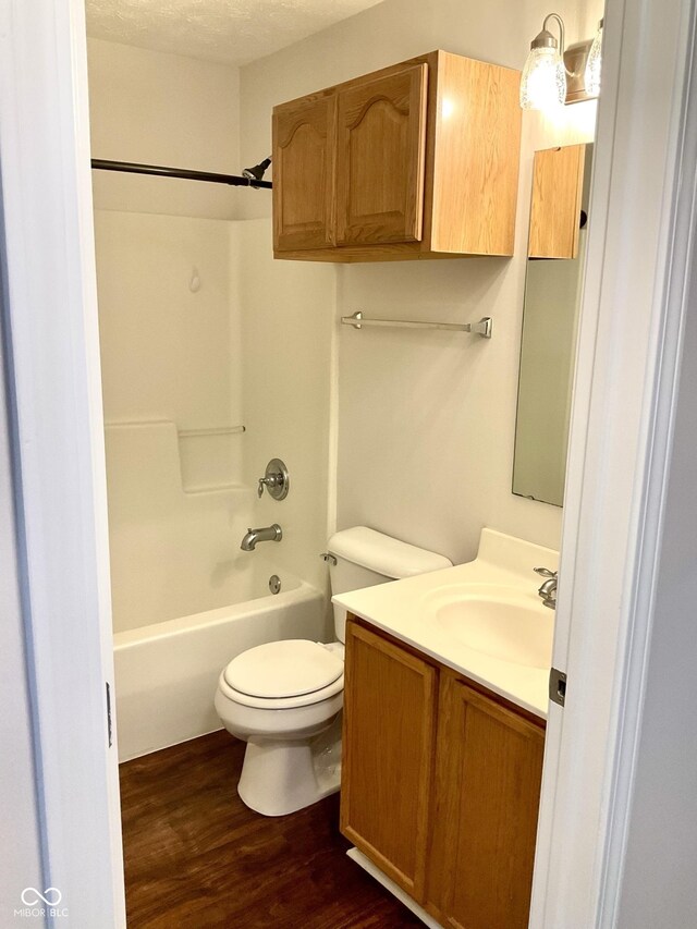 1327 Blue Ridge Ln, Brownsburg, IN 46112 - full bathroom with wood finished floors, toilet, shower / tub combination, and vanity