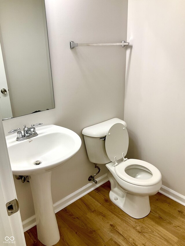 1327 Blue Ridge Ln, Brownsburg, IN 46112 - bathroom with baseboards, wood finished floors, and toilet
