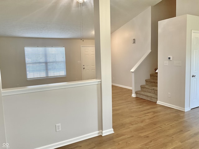 1327 Blue Ridge Ln, Brownsburg, IN 46112 - unfurnished room with wood finished floors, baseboards, and stairway