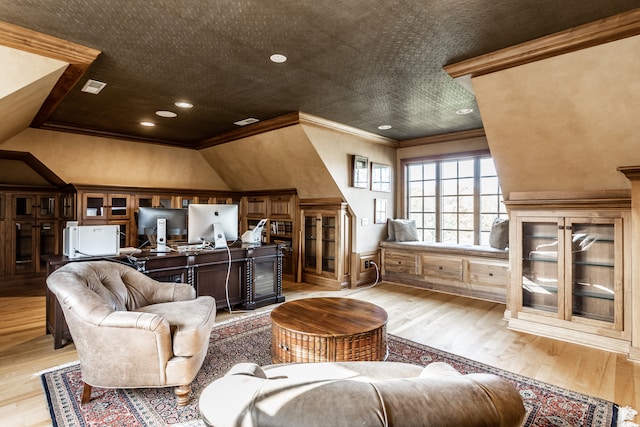 living room featuring light hardwood / wood-style floors and ornamental molding