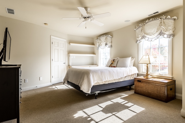 bedroom with ceiling fan and carpet floors