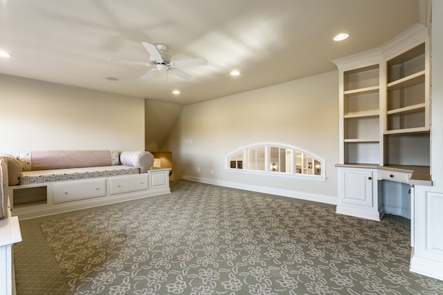 unfurnished living room with dark colored carpet and ceiling fan